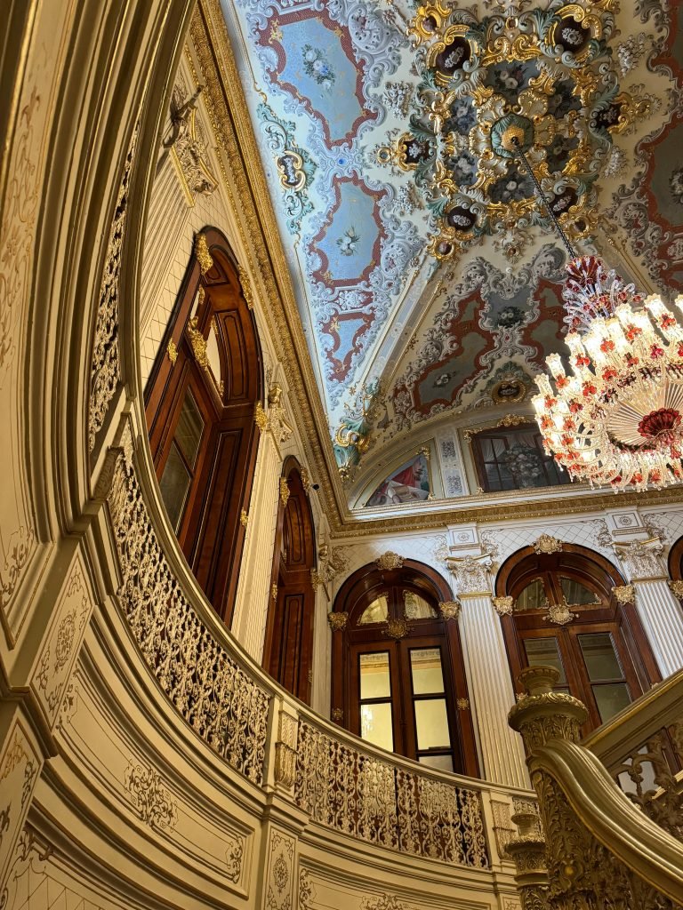 Stunning interior of an ornate historic palace in Istanbul, showcasing intricate architecture and elegant design.